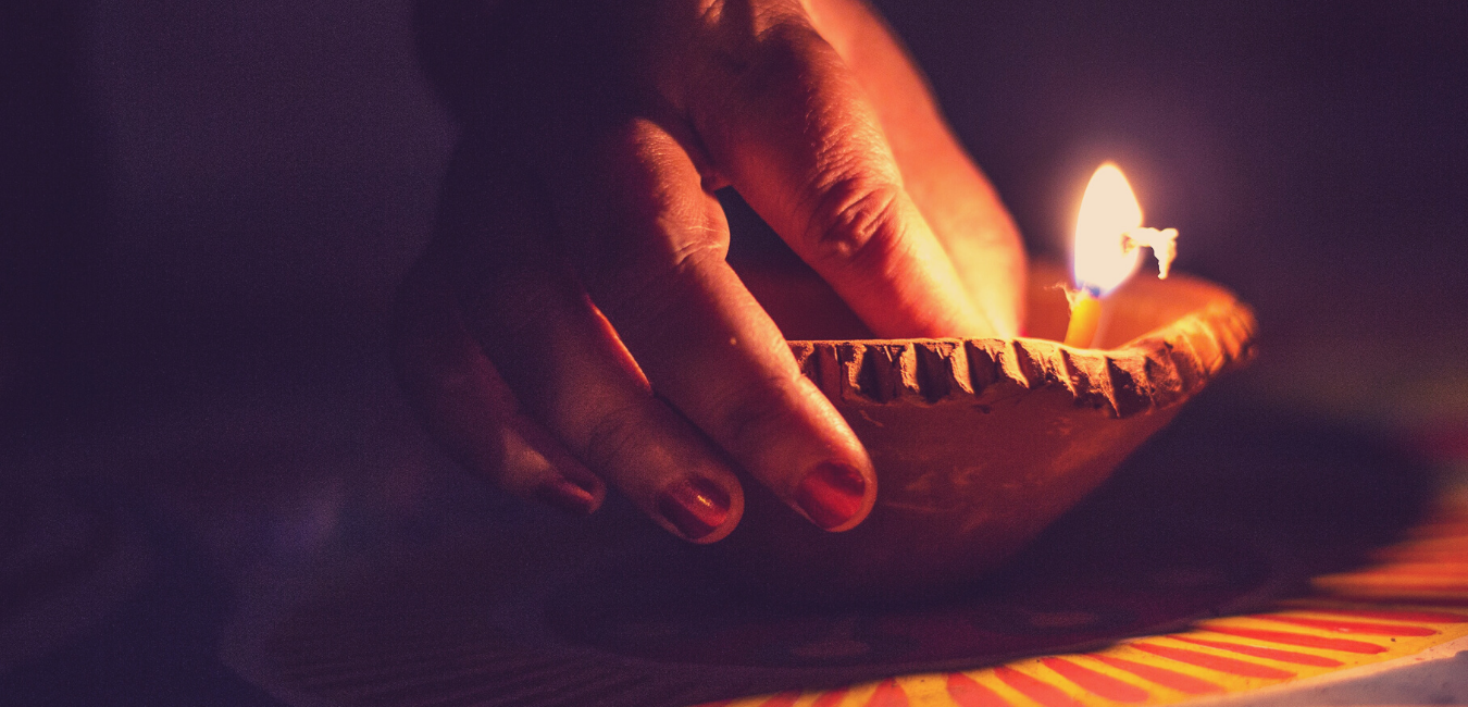 Lighting Diya in Diwali